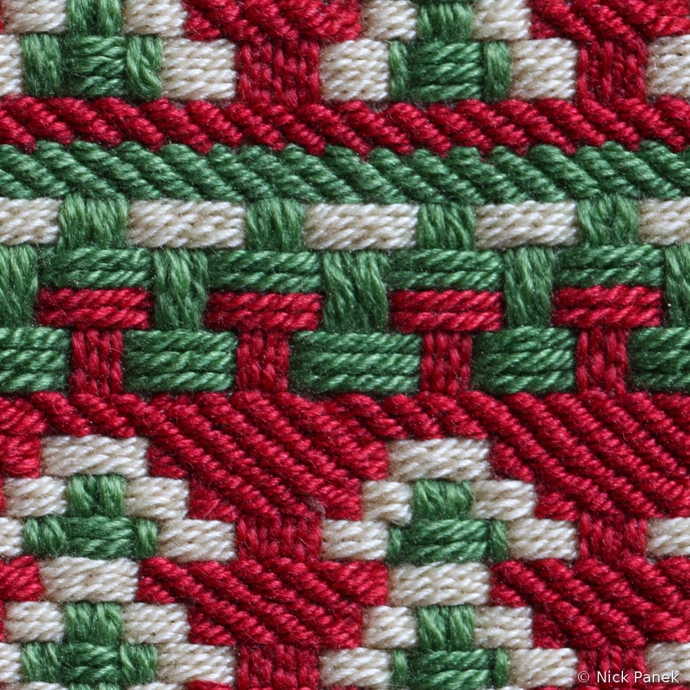 Fabric in Faux Embroidery Christmas Woven Pattern in Red Green and Cream